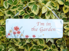 I'm in the garden hanging metal sign.  Buy online only at Honeymellow