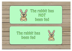 The rabbit has been fed reversible hanging pet sign.
