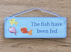 The fish have / have not been fed: double-sided blue sign. Custom-made at www.honeymellow.com